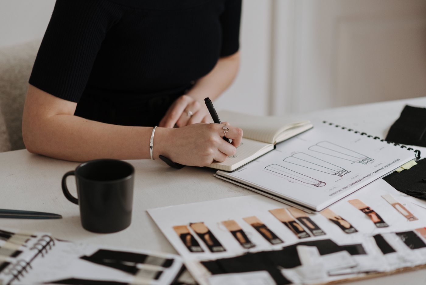 Content planning and creative layouts on a desk.