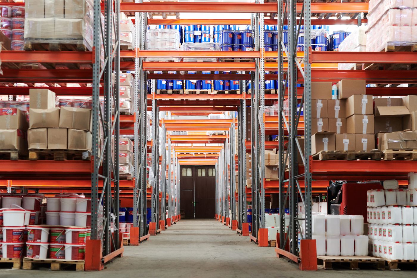 Aisle of stocked shelving in a fulfilment warehouse.
